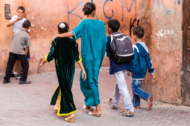 Children on their way home from school in the late afternoon, walking through the narrow streets of the Medina (old walled city), Marrakech.